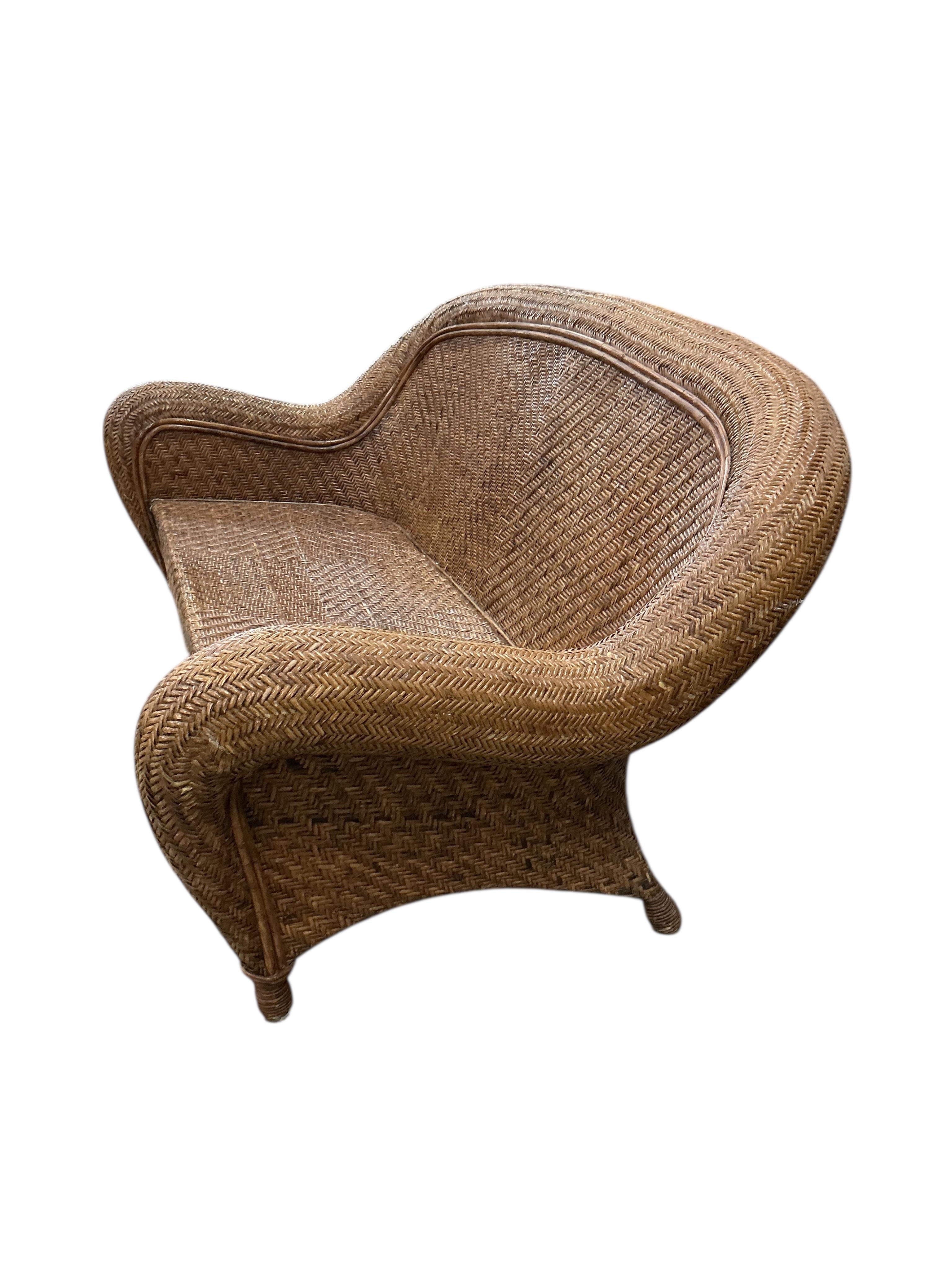 A rattan conservatory settee with associated cushion seat and back, width 186cm, depth 94cm, height 86cm